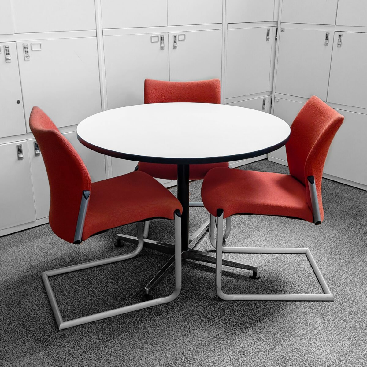 Round Meeting Table & 3 Stacking Meeting Orange Chairs - Image 1